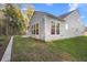 Backyard view of the back of the house with a lawn and trees at 4263 Hugh Bennett Dr, Johns Island, SC 29455