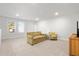 Basement living area with couch, side table, and natural light from the window at 4263 Hugh Bennett Dr, Johns Island, SC 29455
