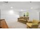 Finished basement with carpet and view of the couch and chair with a window at 4263 Hugh Bennett Dr, Johns Island, SC 29455