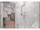 Bright bathroom features glass shower with a seat, with the walk-in closet to the left at 4263 Hugh Bennett Dr, Johns Island, SC 29455