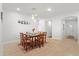 Cozy dining area with views of the entryway and featuring a stylish rug and pendant lighting at 4263 Hugh Bennett Dr, Johns Island, SC 29455