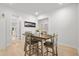 Charming dining area featuring a wooden table, chairs and a view of the adjacent kitchen and ample natural light at 4263 Hugh Bennett Dr, Johns Island, SC 29455