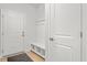 Bright mudroom with white storage bench, coat hooks, and exterior door at 4263 Hugh Bennett Dr, Johns Island, SC 29455
