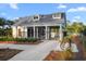 Exterior view of the community pool house featuring ample parking and a bike rack at 4263 Hugh Bennett Dr, Johns Island, SC 29455