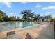 Community outdoor swimming pool with chairs and tables for residents and visitors at 4263 Hugh Bennett Dr, Johns Island, SC 29455