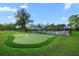 A putting green in the community on a clear and sunny day with white flags at 4263 Hugh Bennett Dr, Johns Island, SC 29455