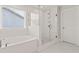 Bright bathroom with a soaking tub and separate glass-enclosed shower at 503 Fiskdale Cir, Summerville, SC 29486