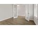 Bright, airy bedroom with wood floors, double doors, and a sunlit window at 503 Fiskdale Cir, Summerville, SC 29486