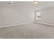 Large bedroom with neutral carpet, crown molding, and a sunlit window at 503 Fiskdale Cir, Summerville, SC 29486