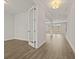 Bright hallway with wood floors leading to a spacious living area with natural light at 503 Fiskdale Cir, Summerville, SC 29486