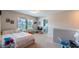 Bright bedroom featuring natural light, playful decor, carpeted floor, and direct access to the laundry area at 5138 Preserve Blvd, Ladson, SC 29456