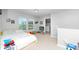 Bright bedroom featuring natural light, playful decor, carpeted floor, and direct access to the laundry area at 5138 Preserve Blvd, Ladson, SC 29456