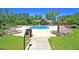 Beautiful community pool surrounded by lounge chairs and lush landscaping at 5138 Preserve Blvd, Ladson, SC 29456