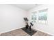 Bright exercise room with hardwood floors, natural light, and a modern stationary bike at 5138 Preserve Blvd, Ladson, SC 29456