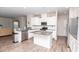 Modern kitchen featuring stainless steel appliances, granite countertops, white cabinets, and center island at 5138 Preserve Blvd, Ladson, SC 29456