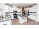 Modern kitchen featuring stainless steel appliances, granite countertops, white cabinets, and center island at 5138 Preserve Blvd, Ladson, SC 29456