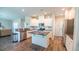 Modern kitchen featuring stainless steel appliances, granite countertops, white cabinets, and center island at 5138 Preserve Blvd, Ladson, SC 29456