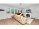 Inviting living room with fireplace, wood floors, and a cozy seating area with comfortable couches at 5138 Preserve Blvd, Ladson, SC 29456