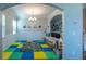 Bright and open playroom with decorative flooring, an archway, and plenty of space at 5138 Preserve Blvd, Ladson, SC 29456