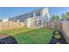 Private fenced backyard featuring a well-maintained lawn and patio for enjoying outdoor living and entertaining at 518 Green Fern Dr, Summerville, SC 29483