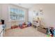 Cozy bedroom featuring a large window, plush carpeting, and ample space for play at 518 Green Fern Dr, Summerville, SC 29483