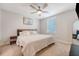 Well-lit bedroom with a ceiling fan, a queen-sized bed, and side tables on each side at 518 Green Fern Dr, Summerville, SC 29483