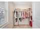Bright and spacious walk-in closet with hanging racks, shelves, and window at 518 Green Fern Dr, Summerville, SC 29483