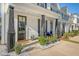 Inviting front porch with decorative columns and tidy landscaping enhance this townhome's curb appeal at 518 Green Fern Dr, Summerville, SC 29483