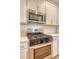 Modern stainless steel gas range and microwave, complemented by white subway tile backsplash and cabinets at 518 Green Fern Dr, Summerville, SC 29483