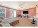 Inviting living area featuring a cozy couch, entertainment center, and access to a modern kitchen at 518 Green Fern Dr, Summerville, SC 29483