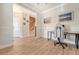Inviting office space with wood floors, natural light, and a view of the home's entry and staircase at 518 Green Fern Dr, Summerville, SC 29483