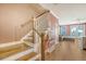 Staircase featuring hardwood treads, white risers and banisters, and an open view to the living area at 518 Green Fern Dr, Summerville, SC 29483
