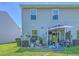The spacious backyard features a patio with outdoor seating, a grill, and green lawn at 531 Truman Dr, Goose Creek, SC 29445