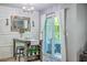 Eat-in dining area features board and batten accent wall and sliding glass doors at 531 Truman Dr, Goose Creek, SC 29445