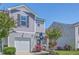 Charming townhome with a garage, manicured landscaping, and a welcoming entryway, complete with South Carolina flag at 531 Truman Dr, Goose Creek, SC 29445