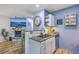 Open-concept kitchen featuring bar seating and a clear view of the living room and fireplace at 531 Truman Dr, Goose Creek, SC 29445