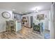 Open kitchen and dining area with stainless steel appliances and wood grain flooring at 531 Truman Dr, Goose Creek, SC 29445