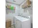 Functional laundry room with washer, dryer, built-in shelving, and ample storage baskets at 531 Truman Dr, Goose Creek, SC 29445