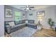 Cozy living room featuring a large sectional sofa, decorative accents, and comfortable seating arrangements at 531 Truman Dr, Goose Creek, SC 29445