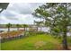 View of a backyard overlooking the waterway with a wooden fence and dock at 545 Towles Crossing Dr # 29455, Johns Island, SC 29455