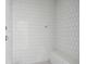 Tiled shower with white subway tiles and a built-in bench offers a clean, modern look to the bathroom at 545 Towles Crossing Dr # 29455, Johns Island, SC 29455
