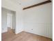 Bedroom with wood flooring, wainscotting, white walls, and an open doorway at 545 Towles Crossing Dr # 29455, Johns Island, SC 29455
