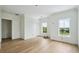 Spacious bedroom featuring beautiful hardwood floors, two windows, and white trim at 545 Towles Crossing Dr # 29455, Johns Island, SC 29455