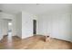 Bedroom with wood flooring, white walls, closet, and an open doorway at 545 Towles Crossing Dr # 29455, Johns Island, SC 29455