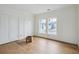Bedroom featuring hardwood floors, closet doors, and a window at 545 Towles Crossing Dr # 29455, Johns Island, SC 29455