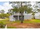 Exterior elevation of a two-story home with a large tree in the front yard at 545 Towles Crossing Dr # 29455, Johns Island, SC 29455