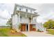 Inviting two-story home featuring a spacious porch, garage, and convenient stair access at 545 Towles Crossing Dr # 29455, Johns Island, SC 29455