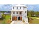 Beautiful two-story home boasts a covered porch, garage, and a charming coastal aesthetic at 545 Towles Crossing Dr # 29455, Johns Island, SC 29455