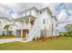 Charming coastal home with a wide porch, garage, and manicured landscaping at 545 Towles Crossing Dr # 29455, Johns Island, SC 29455