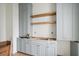 Kitchen area boasts custom cabinets, wooden shelving, and modern fixtures at 545 Towles Crossing Dr # 29455, Johns Island, SC 29455